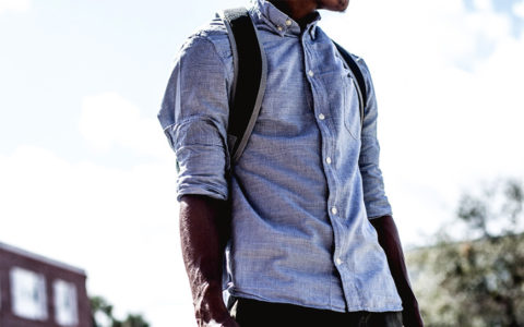 student with a backpack on campus