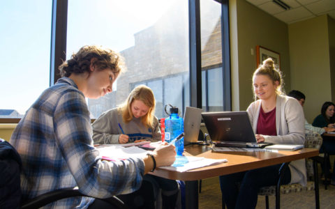 business students in helmeric