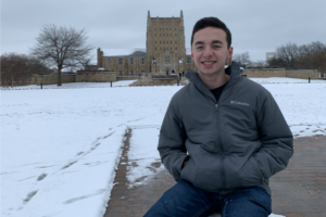 Luke Bertaux on a snowy day in front of McFarlin Library