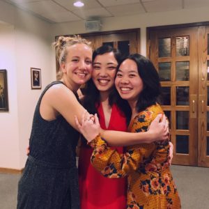 Julianne Tran embracing with two good friends