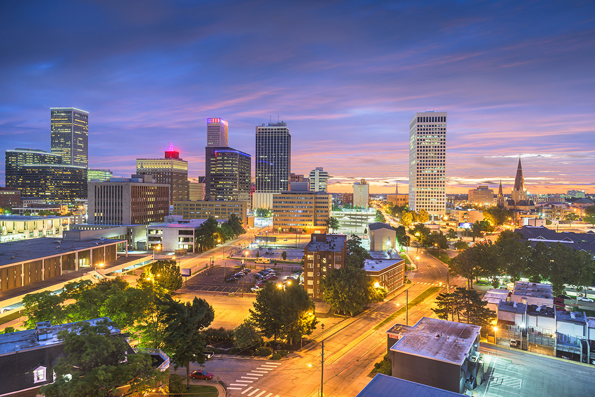 a colorful evening scene of downtown Tulsa buildings