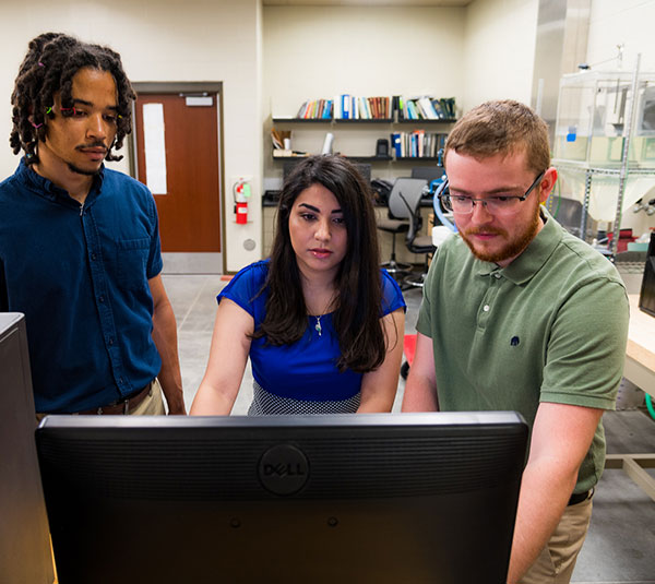 mechanical engineering students at computer