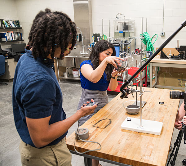 mechanical engineering students work on a project