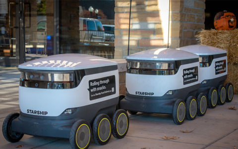 Starship food delivery robots parked in a line in the Student Union