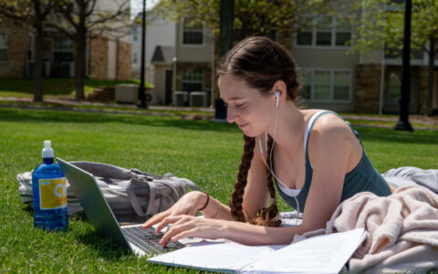 Student studying outdoors for undergraduate admission