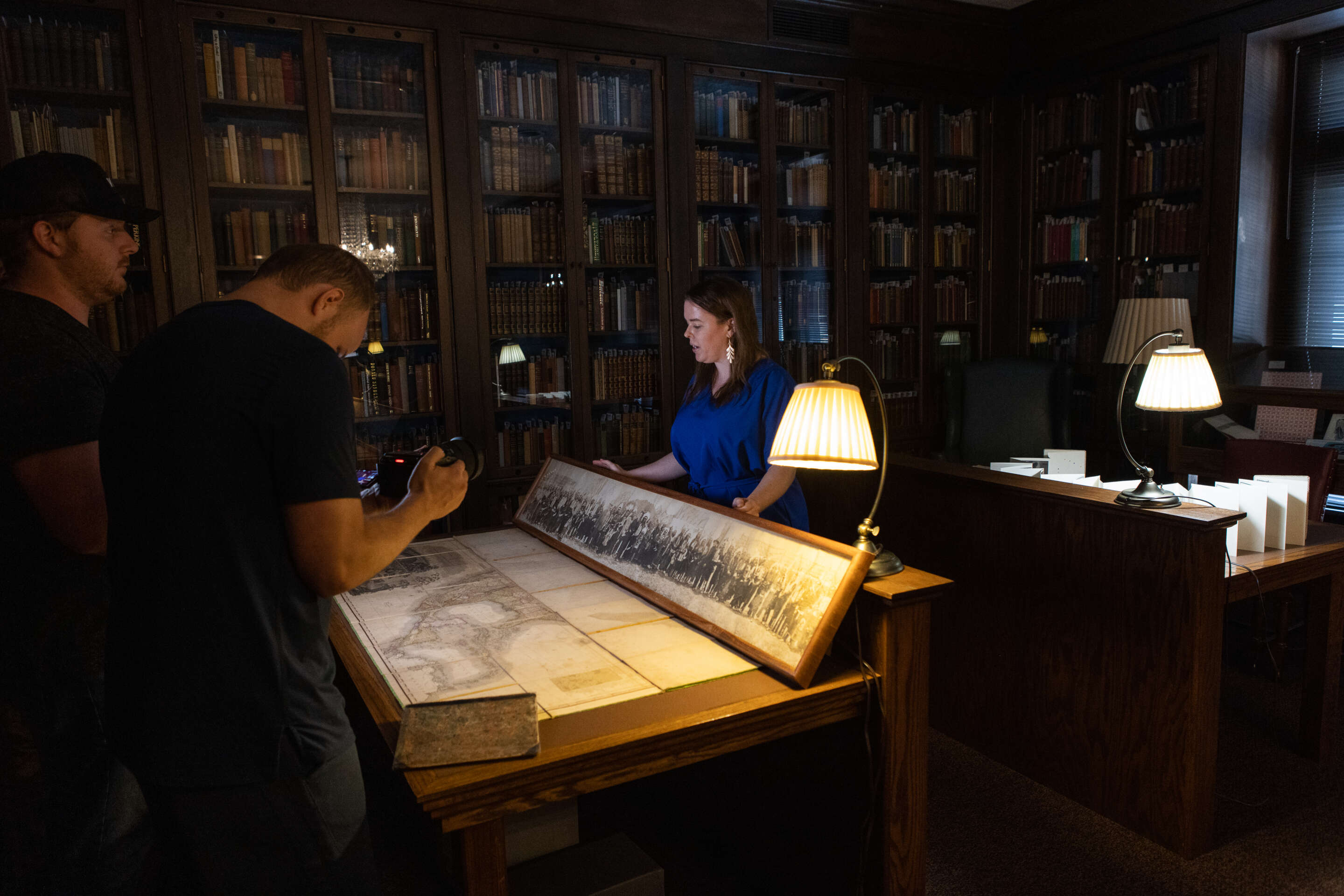 People examining things in a collections room