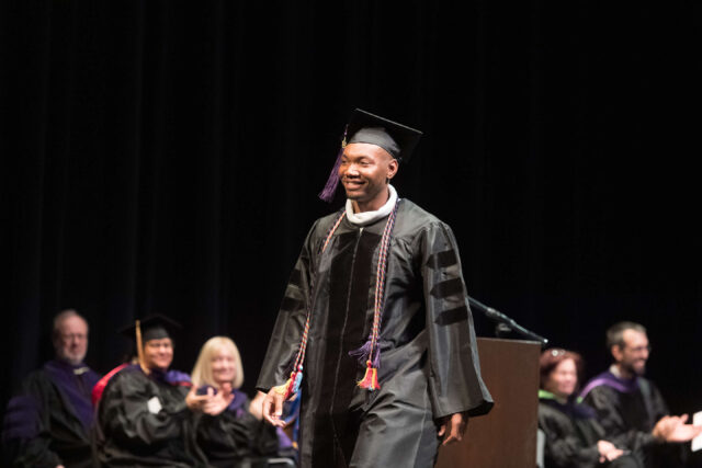 Graduand at TU Law's December 2018 hooding ceremony
