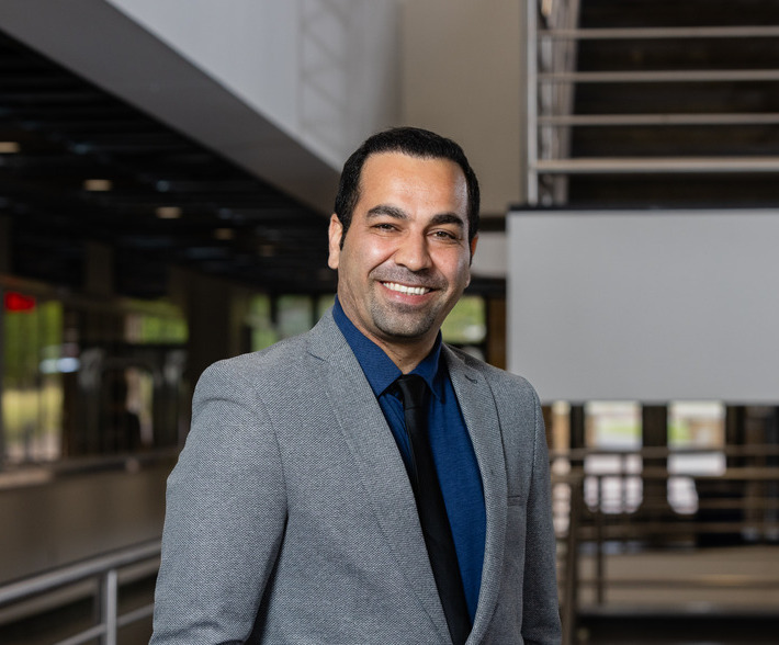 photo of Ahmad Amiri inside of keplinger hall