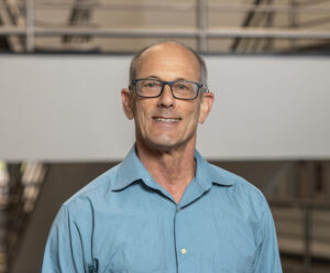 Photo of Neil Gandal in Keplinger Hall at The University of Tulsa.