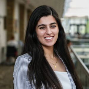 Smiling woman in striped blazer