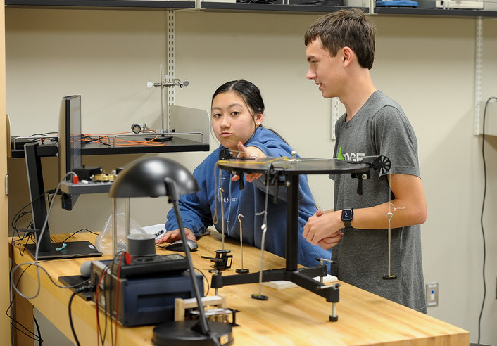 students engaging in a hands-on physics activity