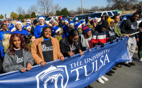 University of Tulsa students carrying a blue TU banner at the 2020 Martin Luther King Junior march in Tulsa