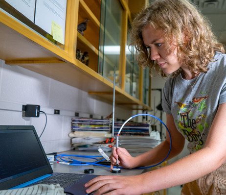 UTulsa student using a flexible camera in a biology lab