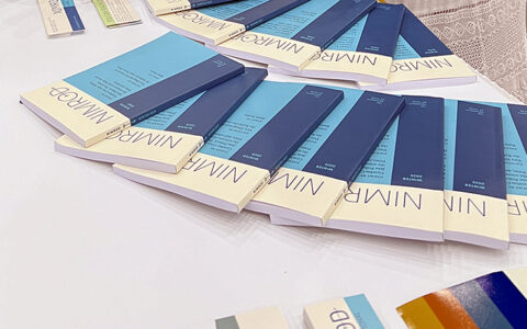 Photograph of copies of Nimrod Journal arranged on a table