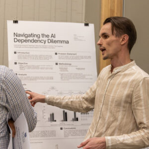 Photograph of a UTulsa student presenting a research project