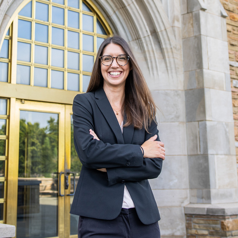 Jill Krefft stands in front of McFarlin Library's arched entrance.