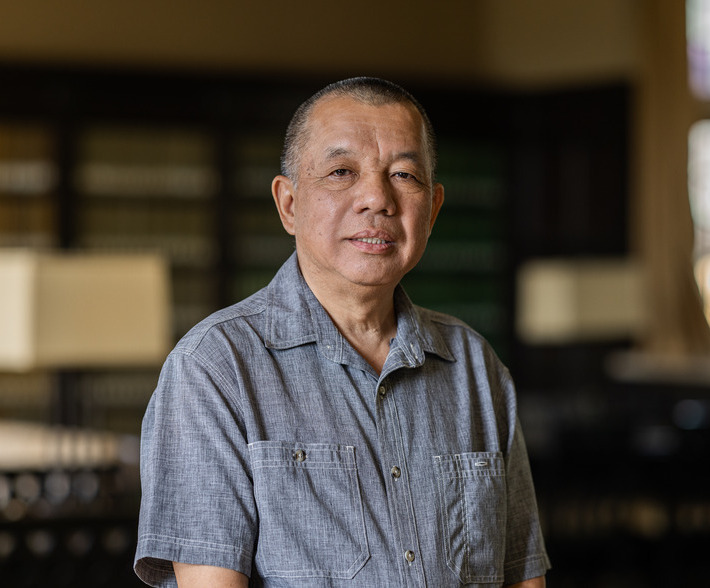 Portrait of the Chair of Computer Science in a gray button-down shirt.