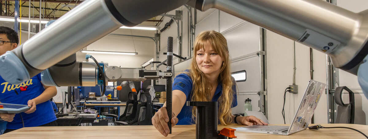 Student working with robotic arm at the Institute for Robotics & Autonomy.