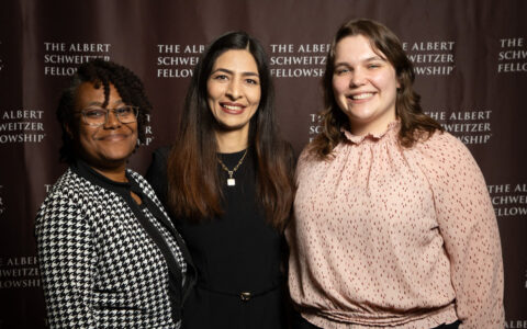 2025-2026 Schweitzer Fellows pose in front of Albert Schweitzer Fellowship backdrop.