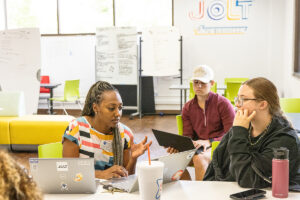 UTulsa JOLT Lounge: Students collaborating with laptops