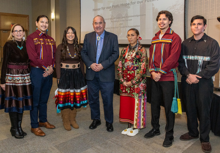 Group photo of Geoffrey Standing Bear, Principal Chief of the Osage Nation, with UTulsa Native American Student Association and Native American Law Student Association leaders.