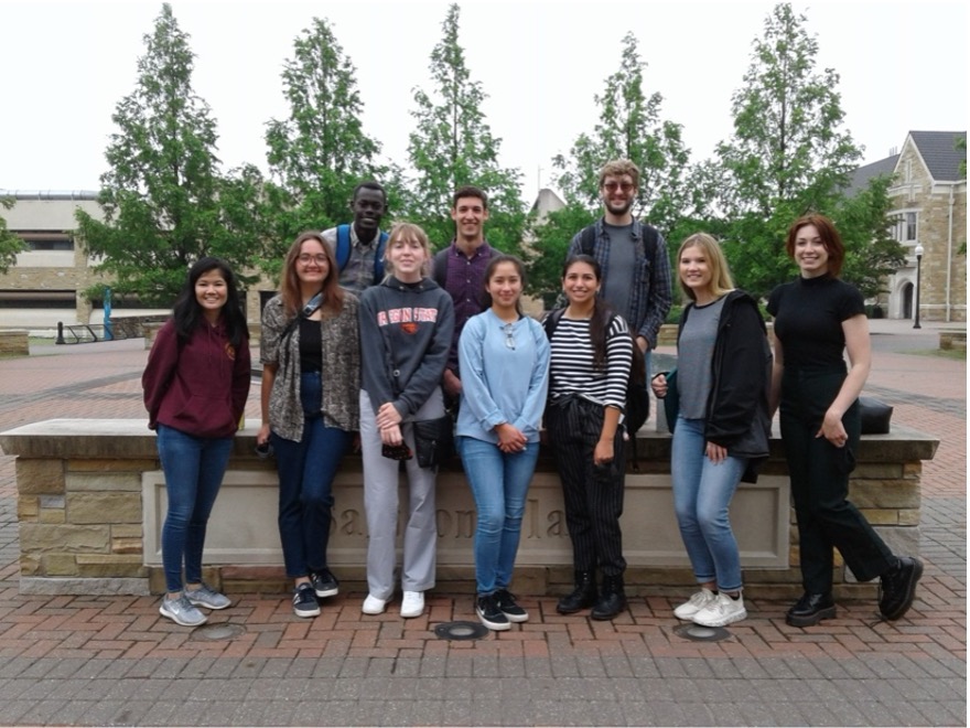 UTulsa students in the NSF undergraduate research program pose outdoors on campus.