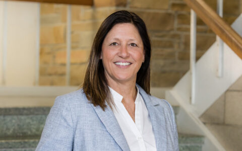 Samantha Beams, Oxley Associate Dean, smiles in a professional portrait.