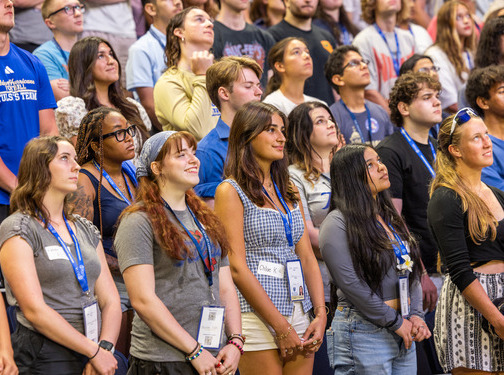 Group of diverse students looking up during New Student Orientation.
