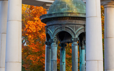Fall foliage behind Kendall Bell.