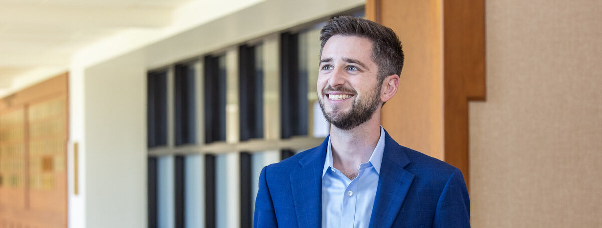Smiling man in a blue suit/