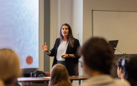 Professor Sahar Abi-Hassan lecturing to students in a classroom.