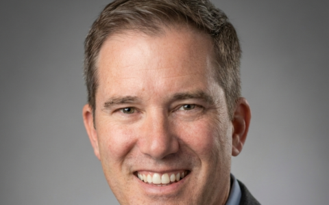 Headshot of a smiling man, possibly related to UTulsa or a brother's legacy.