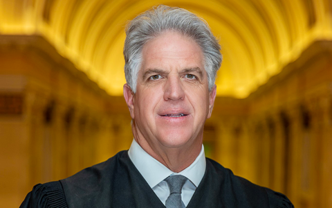 Judge James R. Huber in judicial robes, recently elected to the American Law Institute.