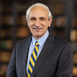 Man in suit with ECS advisory board tie. 