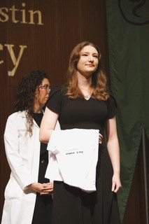 UTulsa pre-health alumna receiving her white coat. Medical school alternatives.