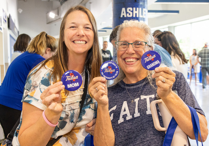 Tulsa Mom and Grandma proudly display university buttons