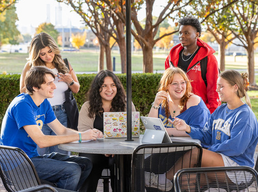 College students studying together outdoors