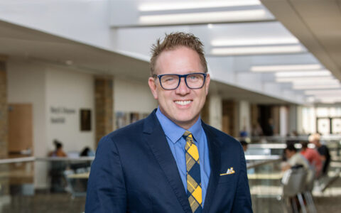 UTulsa Law professor in a suit, reflecting the school's rise in the 2026 rankings.