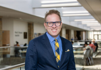 UTulsa Law professor in a suit, reflecting the school's rise in the 2026 rankings.