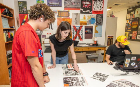 Students review design projects at Third Floor Design.