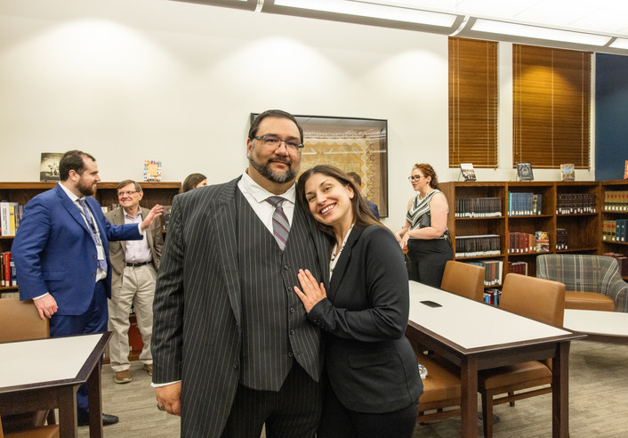 People at Native American law reading room reopening event.