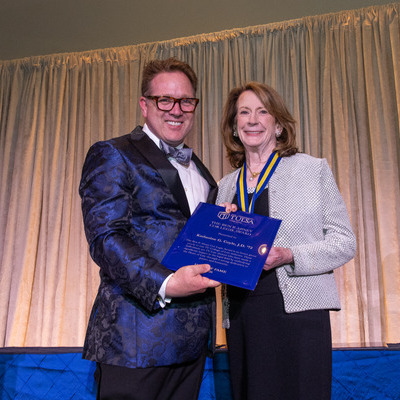 Marc Roark presenting award to Katherine Coyle