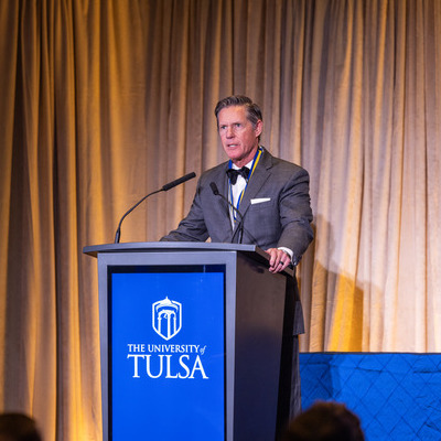 Chief Judge John Heil at University of Tulsa podium, Hall of Fame event.