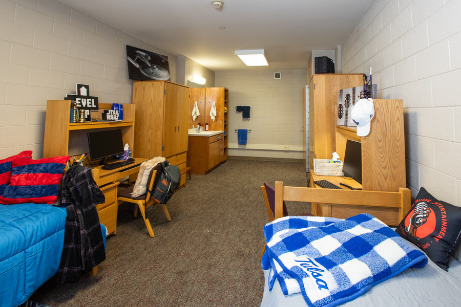 UTulsa LaFortune House dorm room with beds, desks, and a sink area.