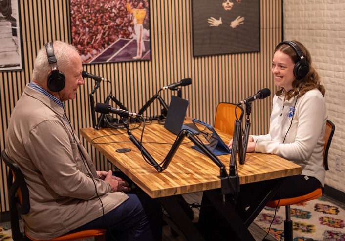 UTulsa student podcast recording with two people at microphones.
