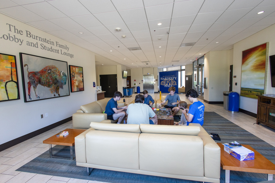 Students playing a game in the Hardesty Hall lounge area