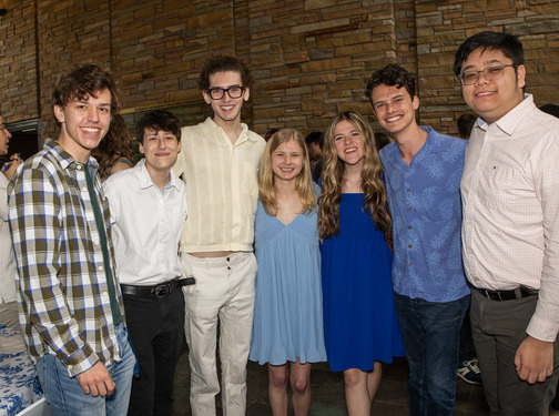 Students posing for a photo at an honors event