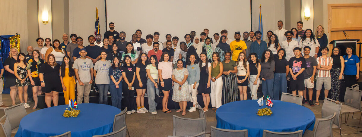 Group of international students posing for a picture with CGE staff.