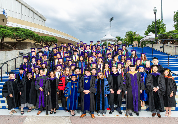 2026 law graduates in academic regalia at Hooding Ceremony