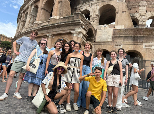 Honors students pose in front of the Colosseum in Rome, Italy.